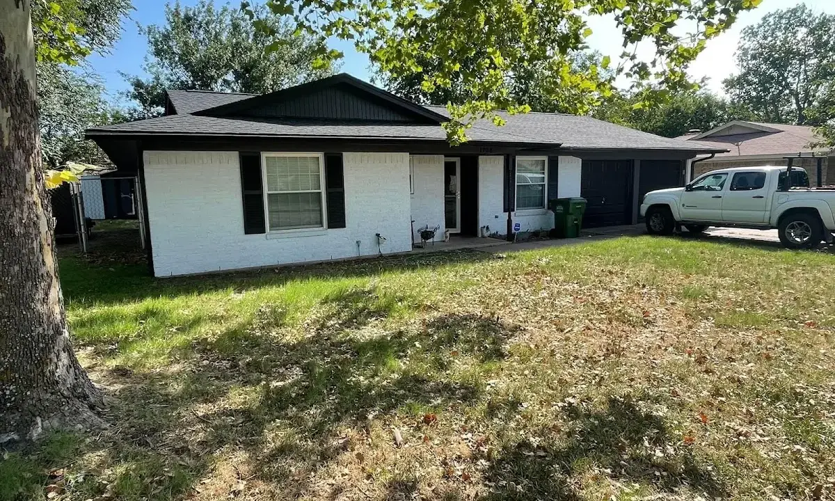 Professional roofing crew working on a residential roof in Air Force Academy